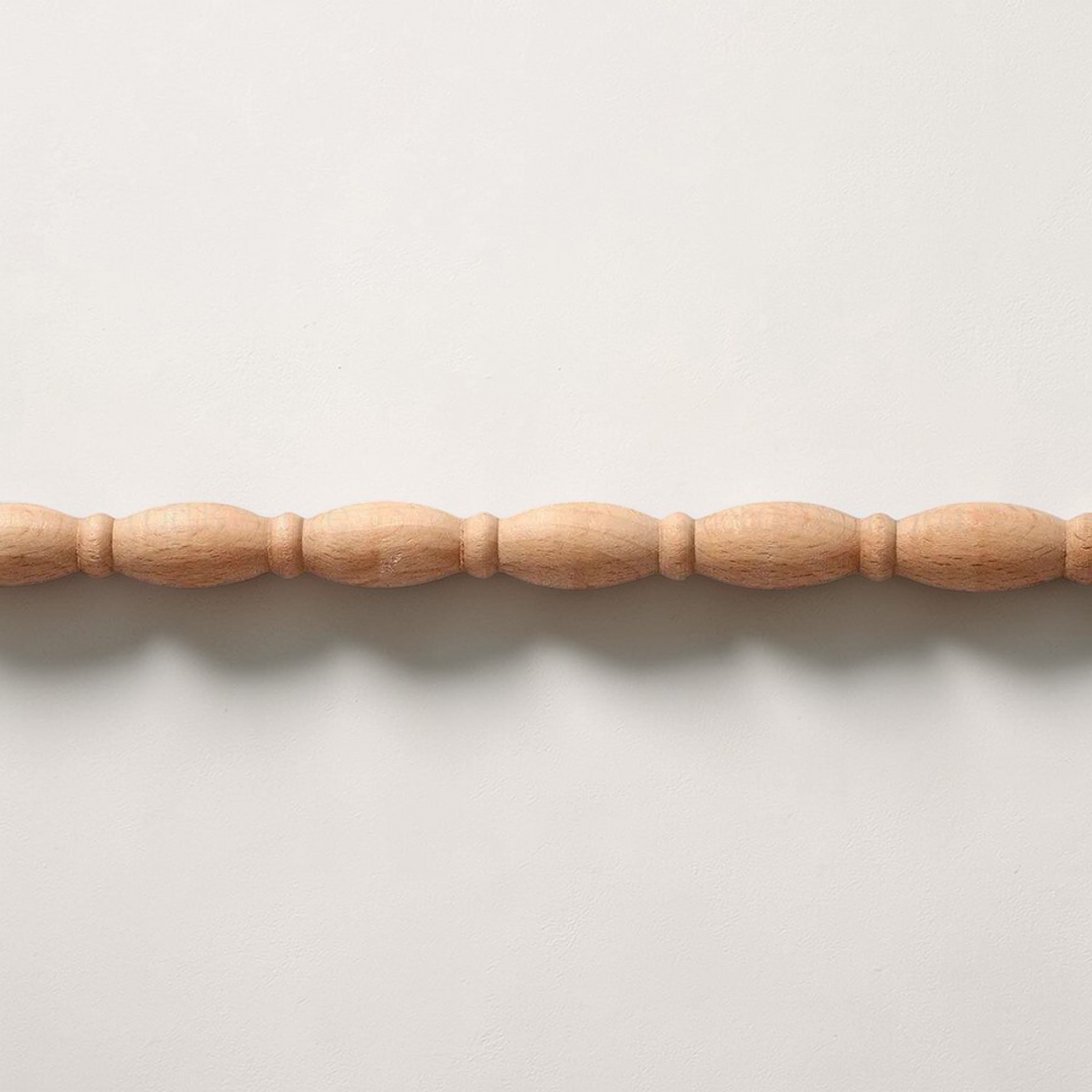 Semi-circular gourd-style wood carved line bar for decorative mirror framing.