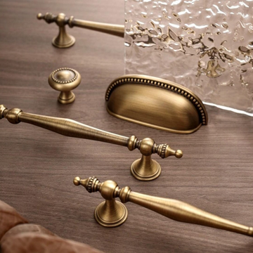 The Antique Sovereign solid brass handles and knobs in antique brass for rustic furniture.
