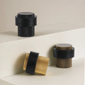 BARREL knurled brass floor mount door stop in gold, matte black and bronze — heavy duty interior bumper