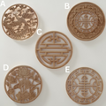 Various sizes of round rose wood carved rosettes from 10cm to 40cm on a white background.