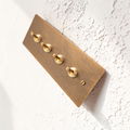 Retro aged brass toggle and dimmer switch panel in 1–4 gang options made from solid brass.