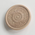 A collection of round floral wood carving rosettes in various sizes from 2 to 16 inches.