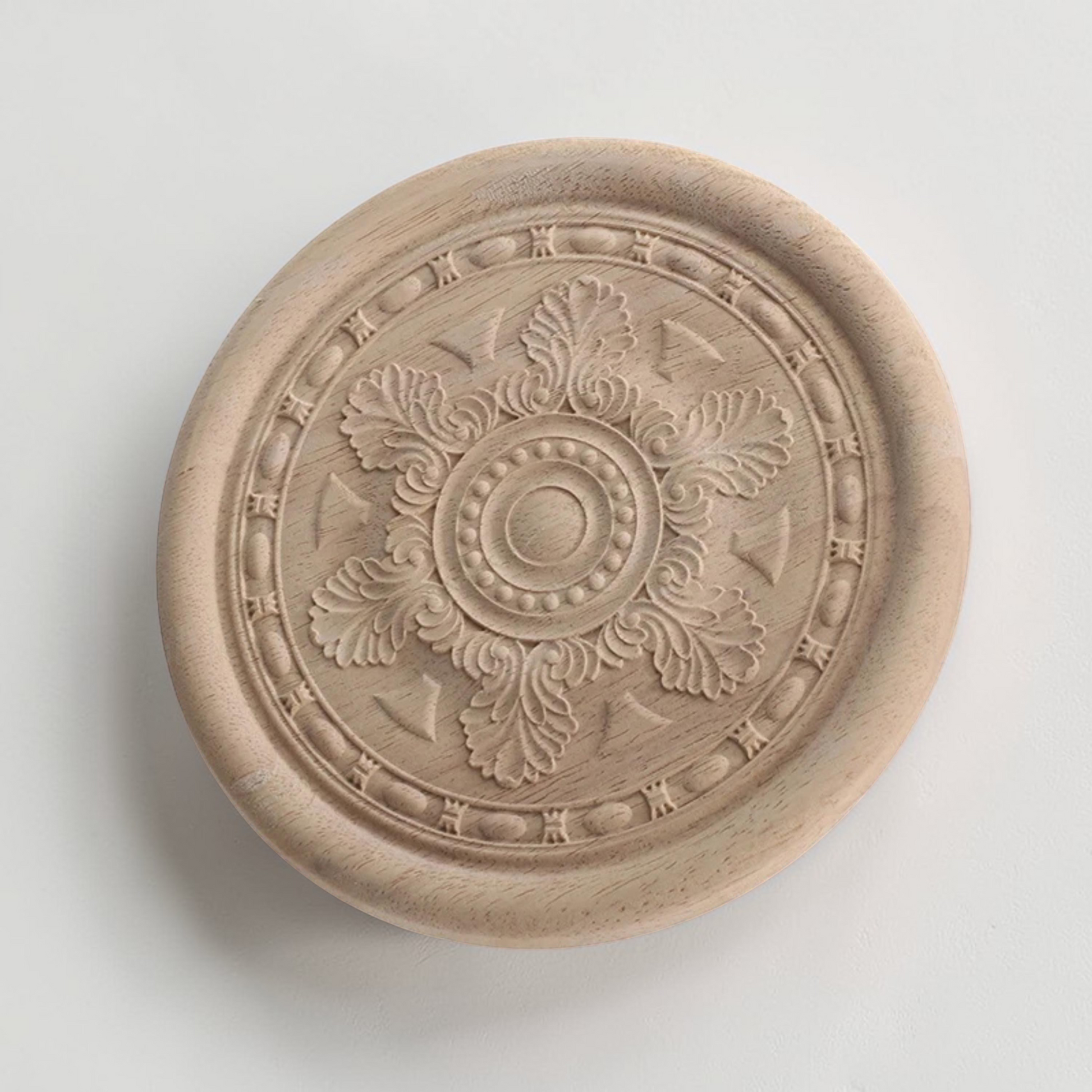 A collection of round floral wood carving rosettes in various sizes from 2 to 16 inches.