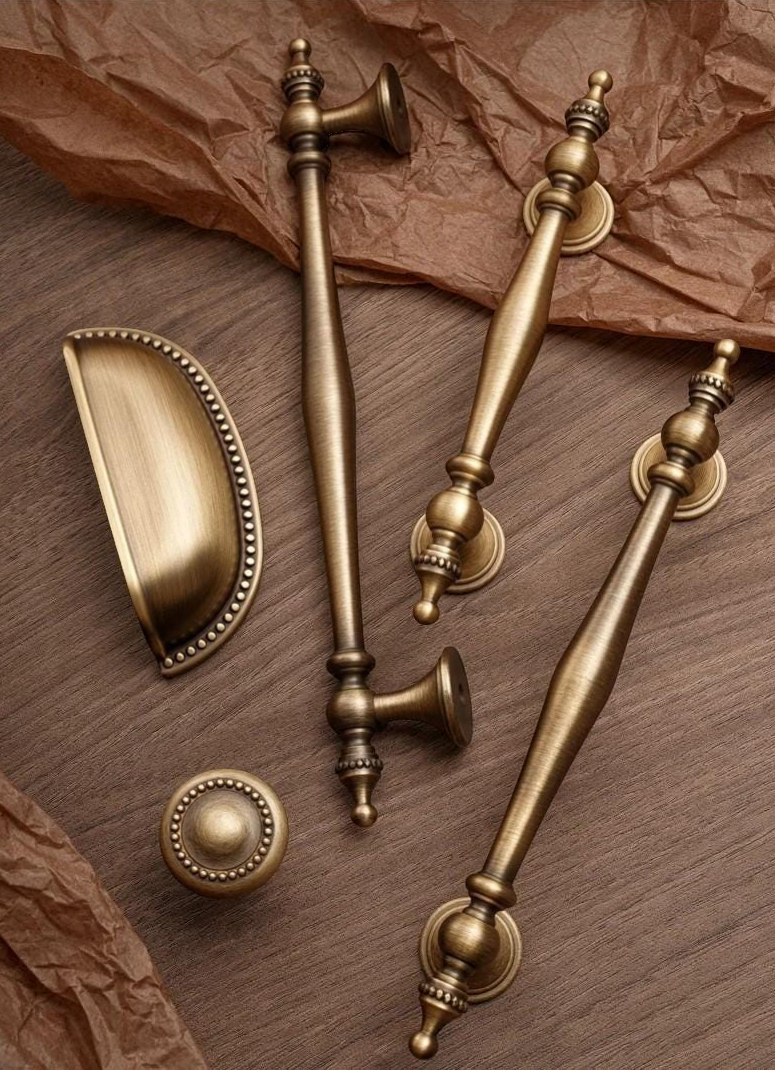 The Antique Sovereign solid brass handles and knobs in antique brass for rustic furniture.