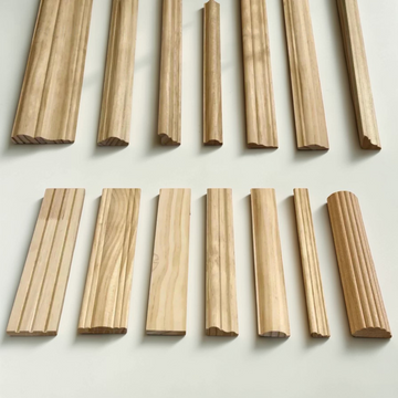 Unpainted ornate carved wood line bars for mirror frames on a white background - Natural wood.
