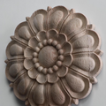 Large 16-inch round wood rosette used as a central fireplace mantel decoration.