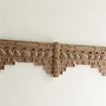 Unpainted wavy wood edge strip showing natural rubber wood grain.