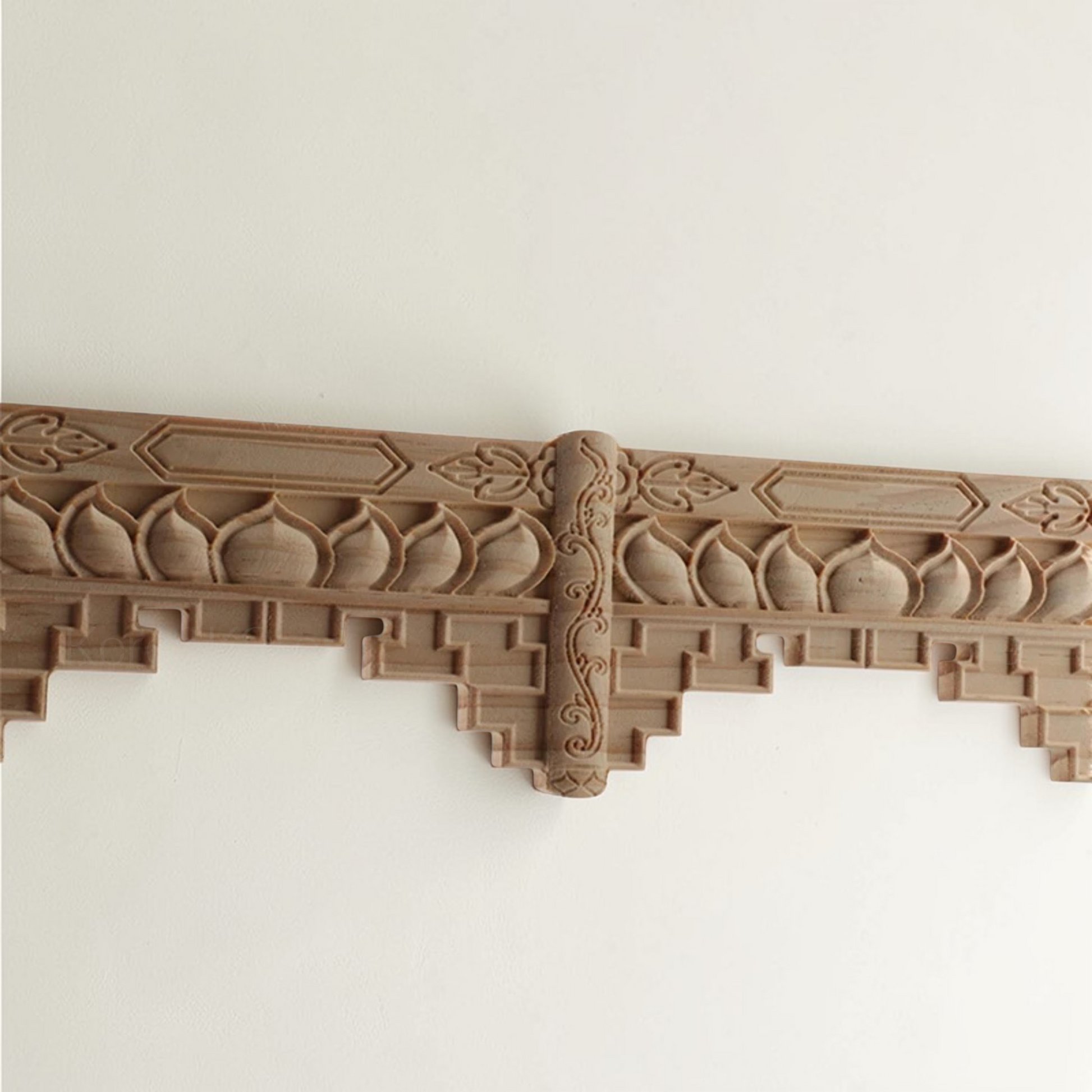 Unpainted wavy wood edge strip showing natural rubber wood grain.