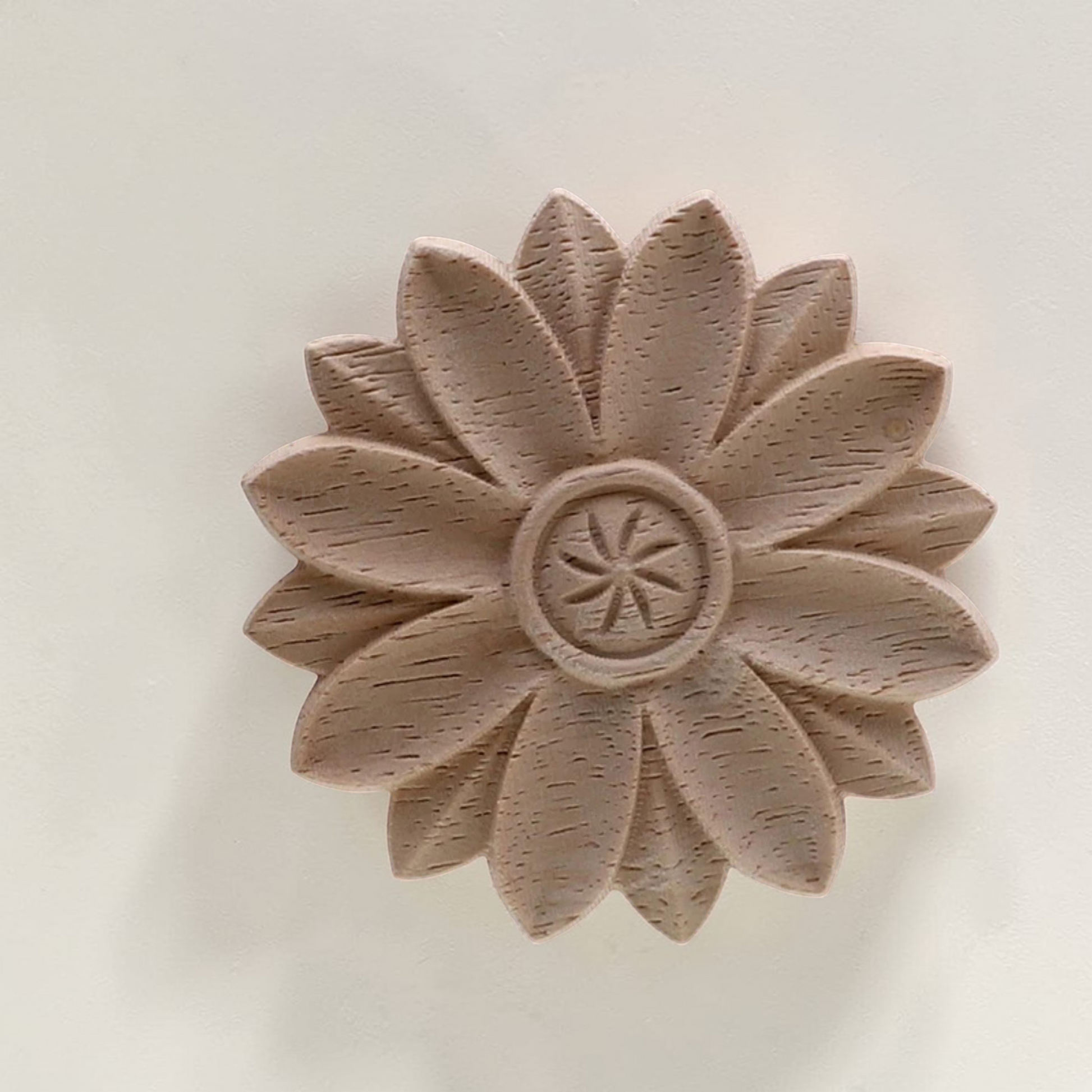 Round vintage floral wood carving rosette on a white background - Unpainted natural wood.