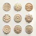 Round and oval vintage floral wood carving rosettes on white background - Raw natural wood.