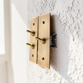 Aged brass toggle light switch plate in retro style
