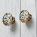 Vintage brass cabinet knob with birds and floral decorative design