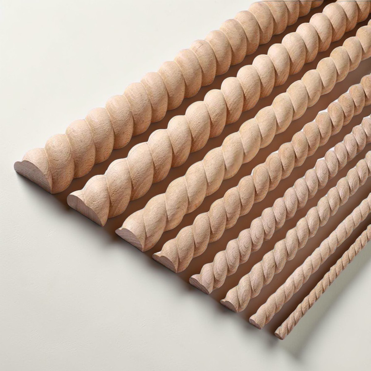 Nautical twist carved wood molding for decorative mirror frame borders.

close-up of unpainted rope-style wood trim showing carved texture.