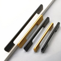Extra-long modern aluminum cabinet handle in matte black and gold finish on wardrobe door