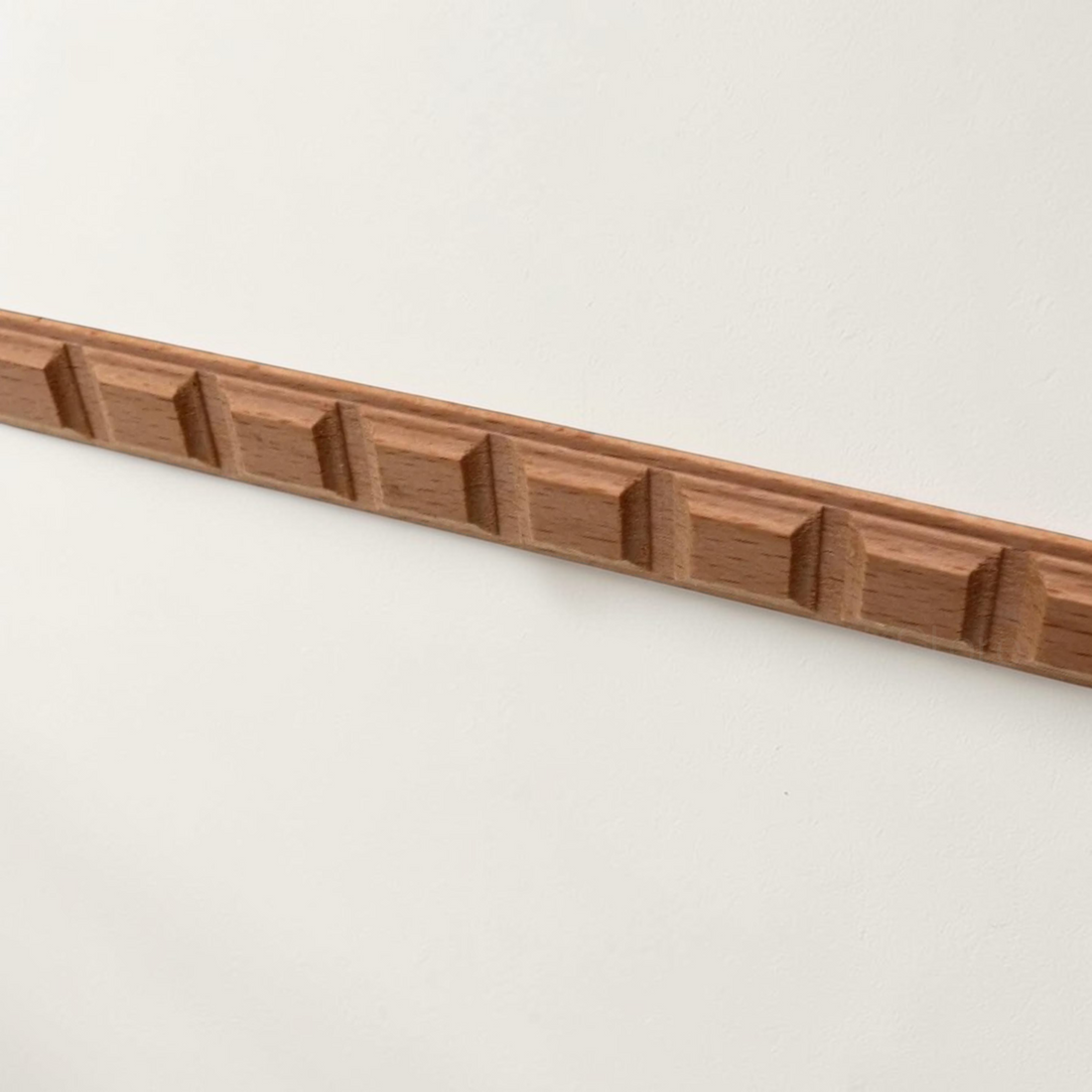 Ornate wood carved line bars for decorative mirror framing and wall edge trim.