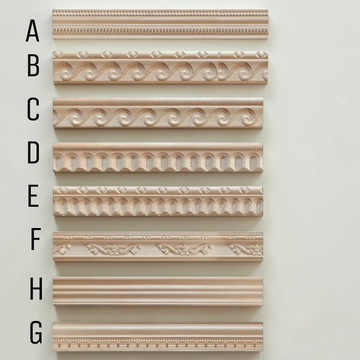 Set of decorative cornice molding samples on a light gray background