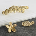 Luxury gold flower-shaped cabinet knob on kitchen drawer furniture