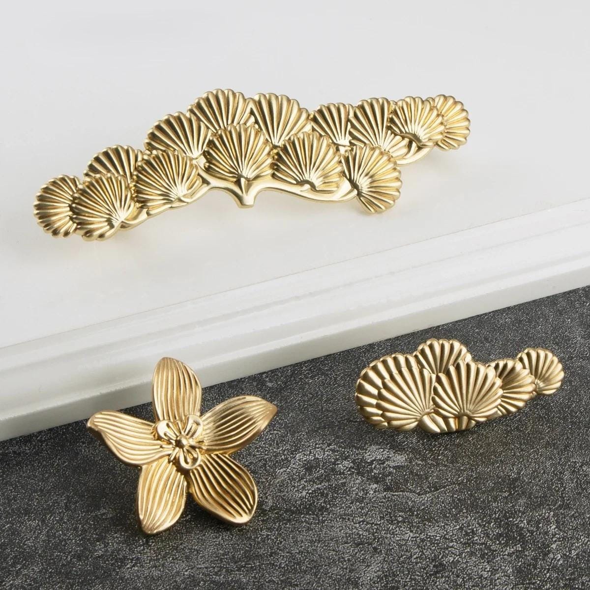 Luxury gold flower-shaped cabinet knob on kitchen drawer furniture