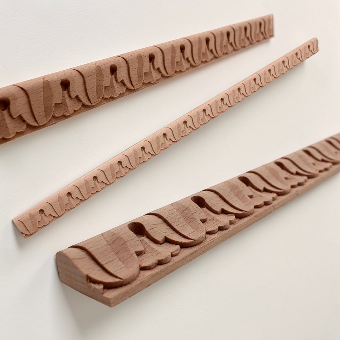 Decorative wood carved line bars for mirror frames and wall edge trim.
