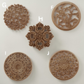 A large 40cm rose wood carving installed as a central decoration on a classic white cabinet.