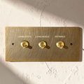 Custom labeled retro brass toggle switch plate

Aged brass dimmer switch with engraved labels

Vintage brass wall switch plate for kitchen and hallway

Solid brass labeled switch cover for luxury interiors