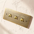 Custom labeled retro brass toggle switch plate

Aged brass dimmer switch with engraved labels

Vintage brass wall switch plate for kitchen and hallway

Solid brass labeled switch cover for luxury interiors